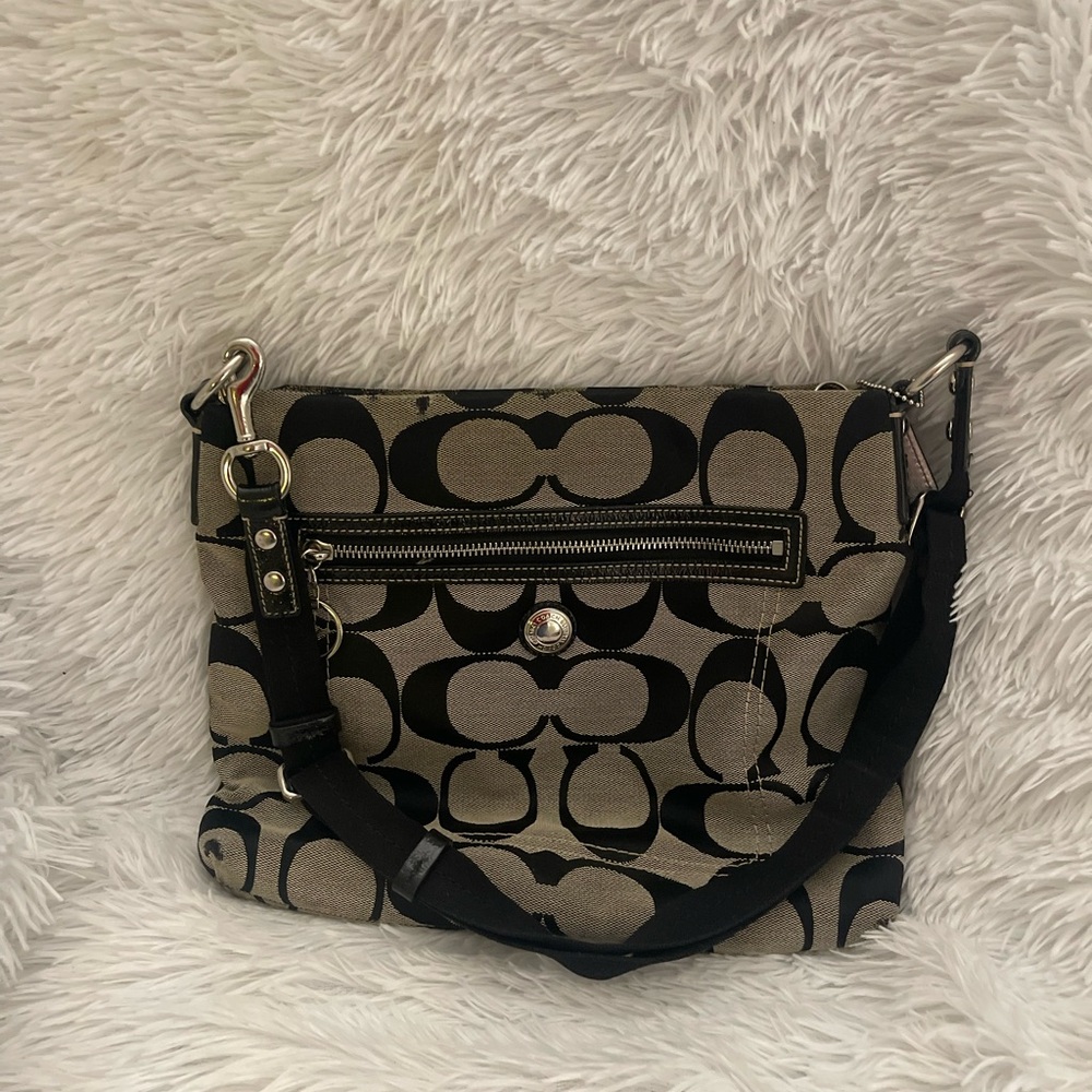 Gray crossbody Coach bag with black Cs